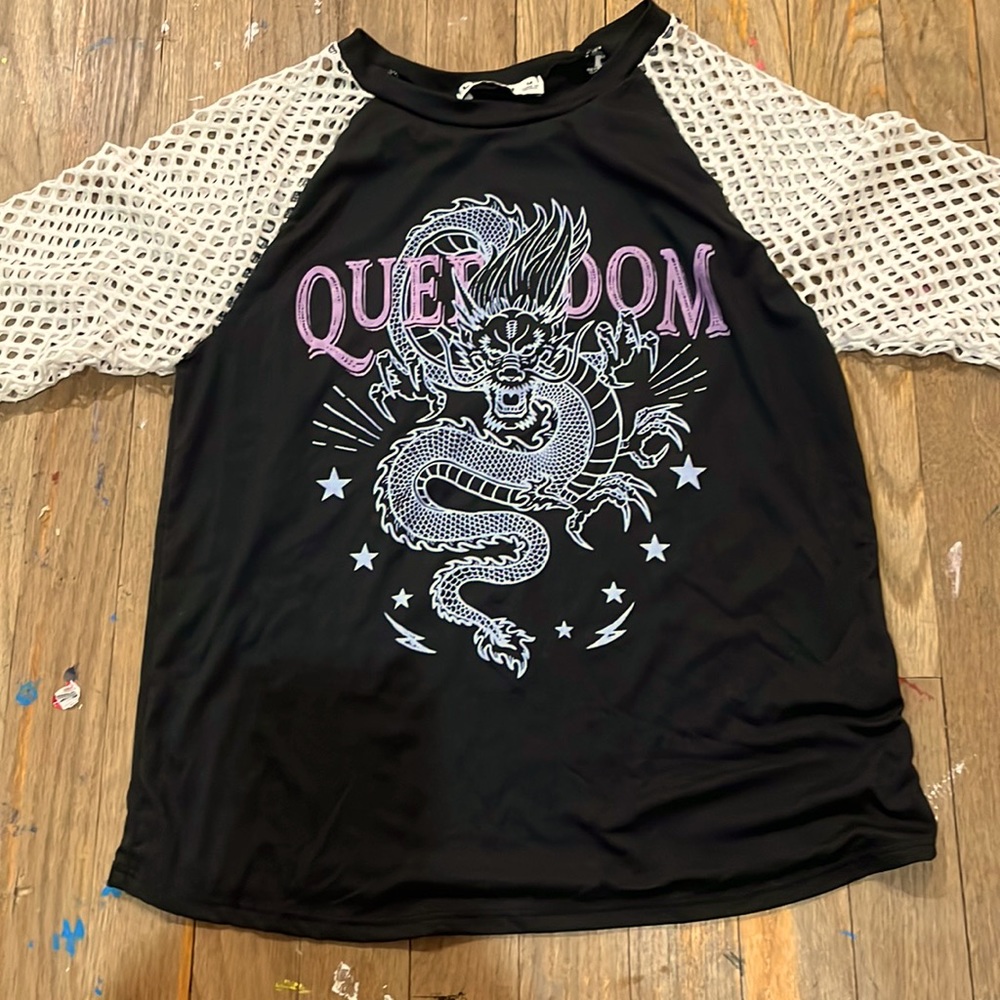 I am selling this fishnet shirt with a dragon print on it